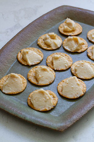 Miso cream cheese spread arranged on top of rice crackers.