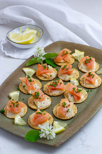 SIde view of smoked salmon canapes with miso cream cheese spread.