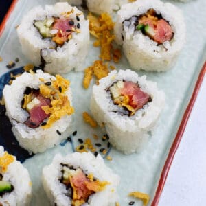Close up shot of crunchy tuna uramaki (inside out sushi rolls).