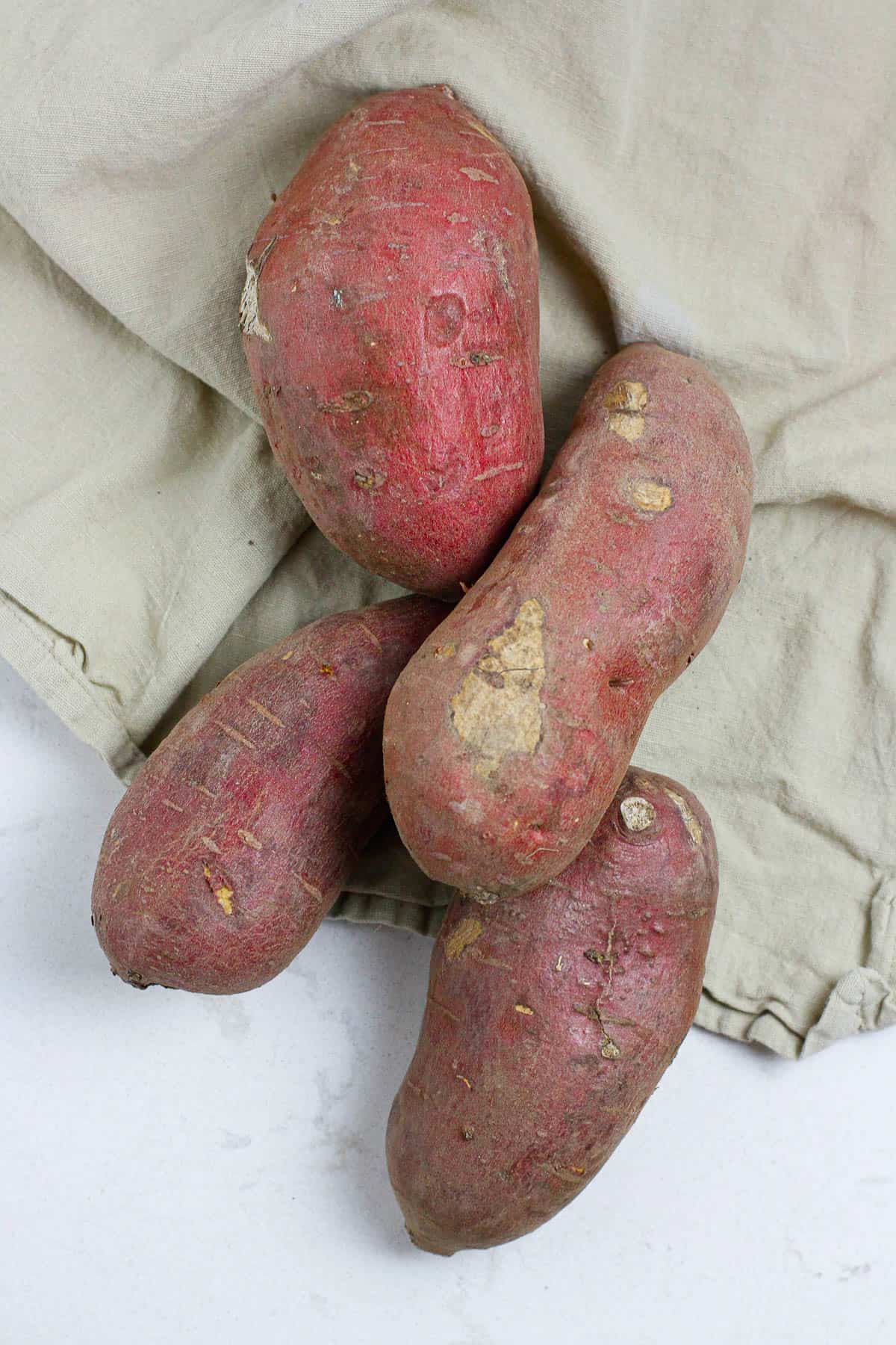 Top view of four Japanese sweet potatoes.