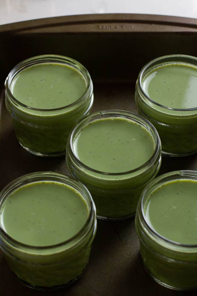 Matcha pudding mix in small cups.