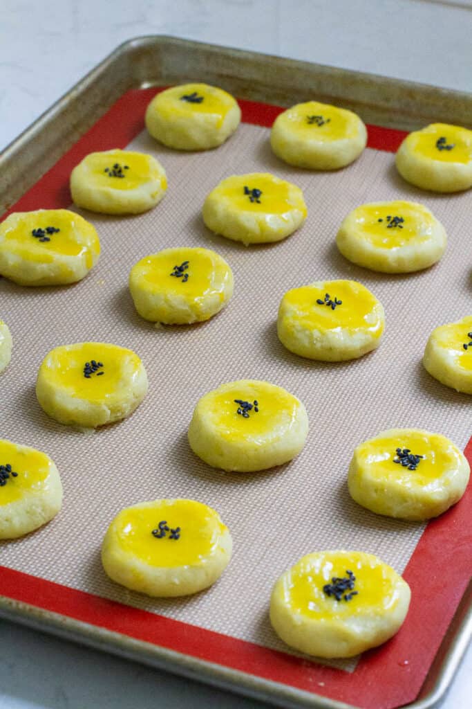 Japanese sweet potato dessert shaped in round pieces and arranged on a baking sheet.