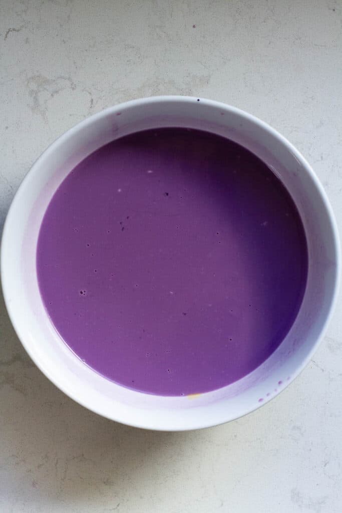 Wet ingredients for ube mochi in a bowl.