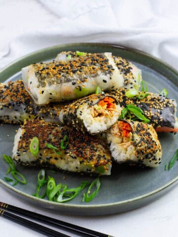 Crispy rice paper sushi rolls on a plate.