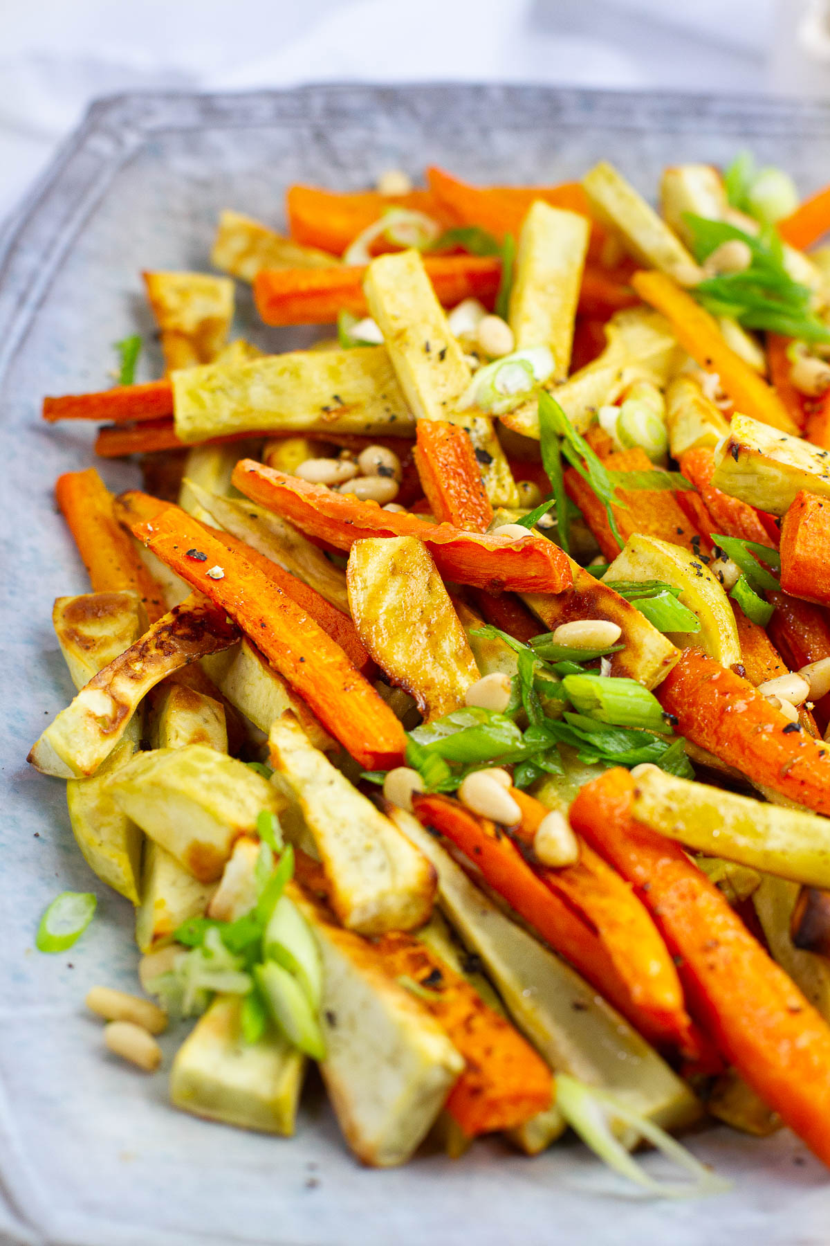 Roasted Japanese sweet potatoes and carrots with pine nuts topping.