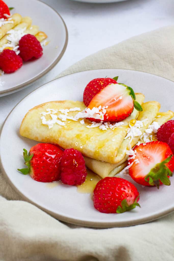 Coconut milk crepes on a plate.