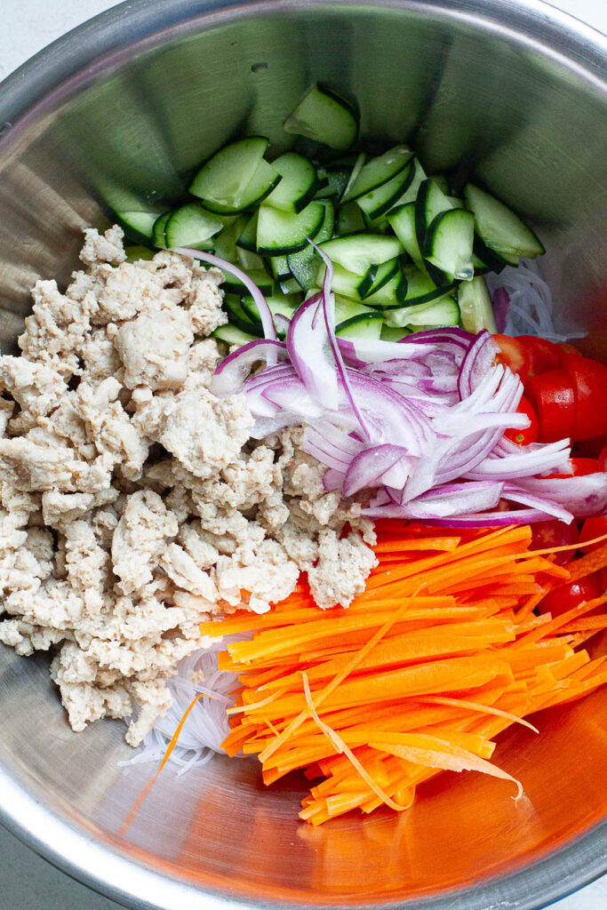 Ingredients for Thai glass noodle salad in a bowl.
