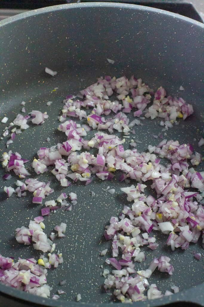 Red onion and garlic in a pan.