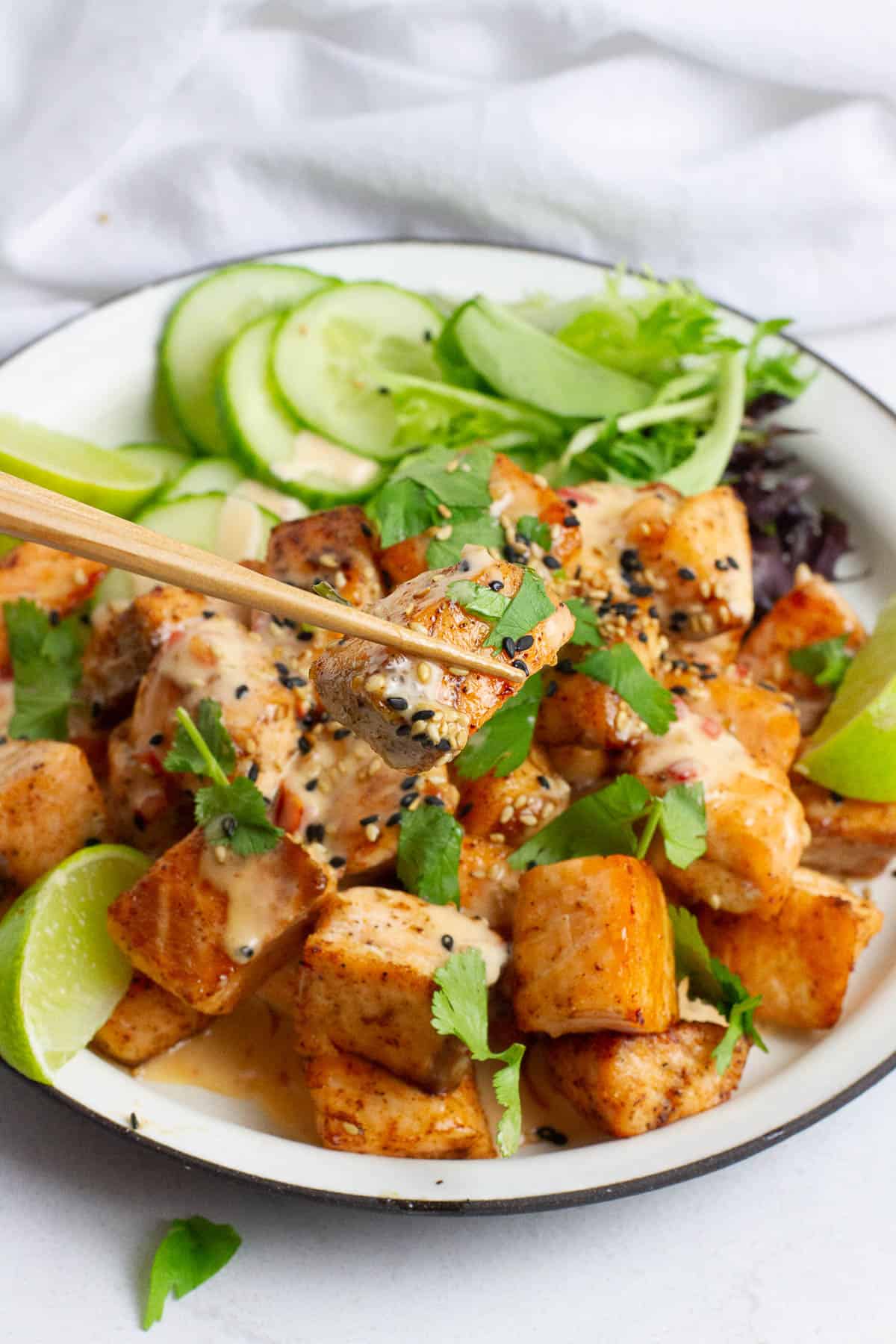 Bang Bang Salmon Bites has resisted with chopsticks.