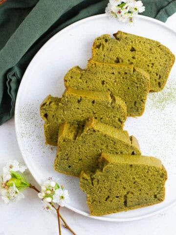 Matcha loaf cake slices on a plate.