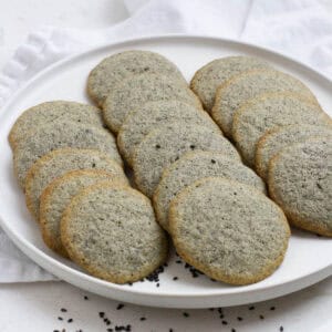 Black sesame cookies on a plate.