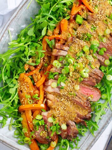 Top view of arugula steak salad.