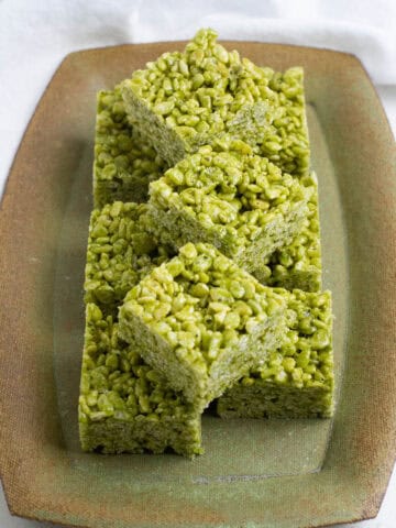 Matcha Rice Krispie Treats on a rectangular plate.