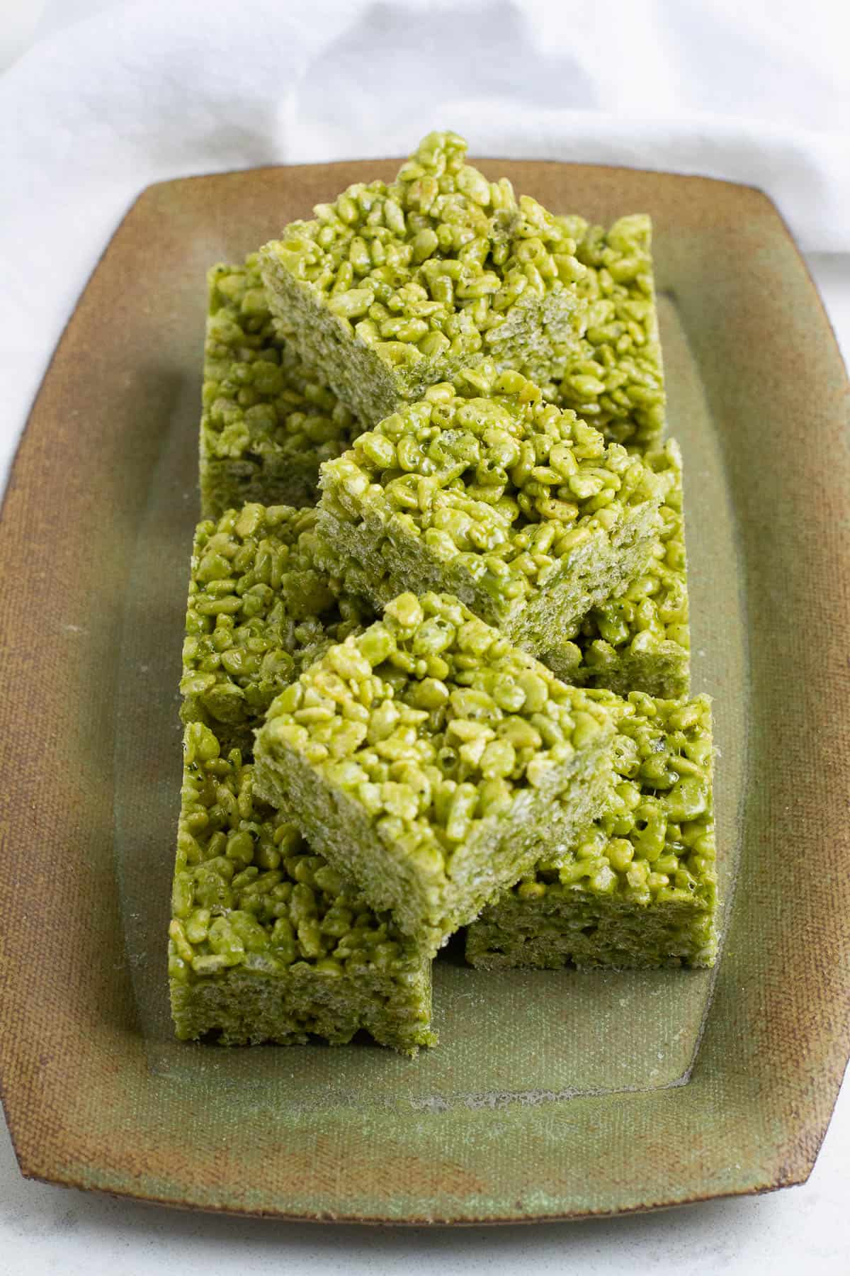 Matcha Rice Krispie Treats on a rectangular plate.