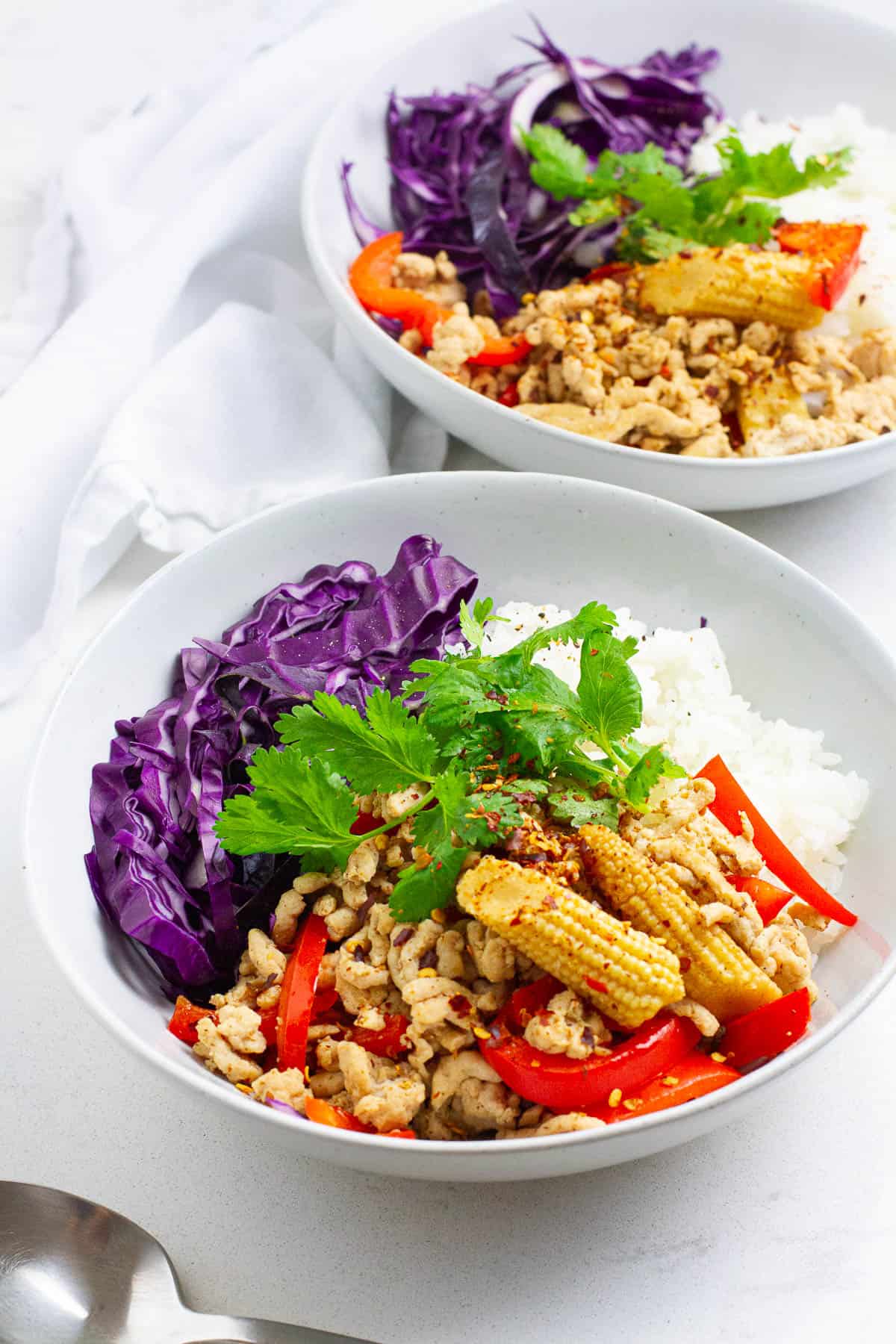 Spicy ground chicken stir fry in bowls.
