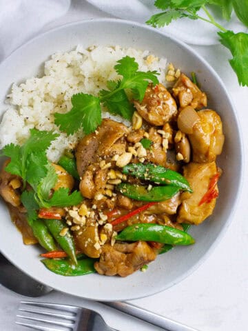 Top view of chicken satay stir fry with rice.