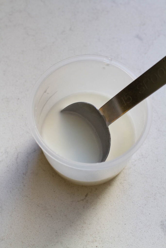 Cornstarch slurry in a cup.