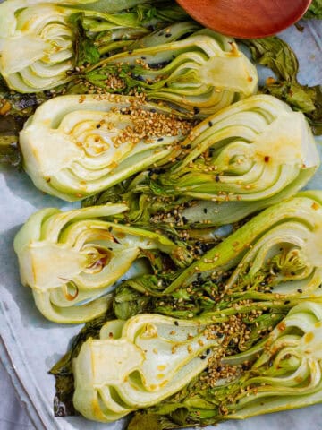 Top view of halved roasted bok choy.