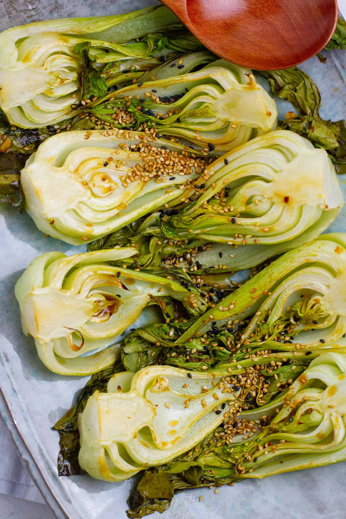 Top view of halved roasted bok choy.