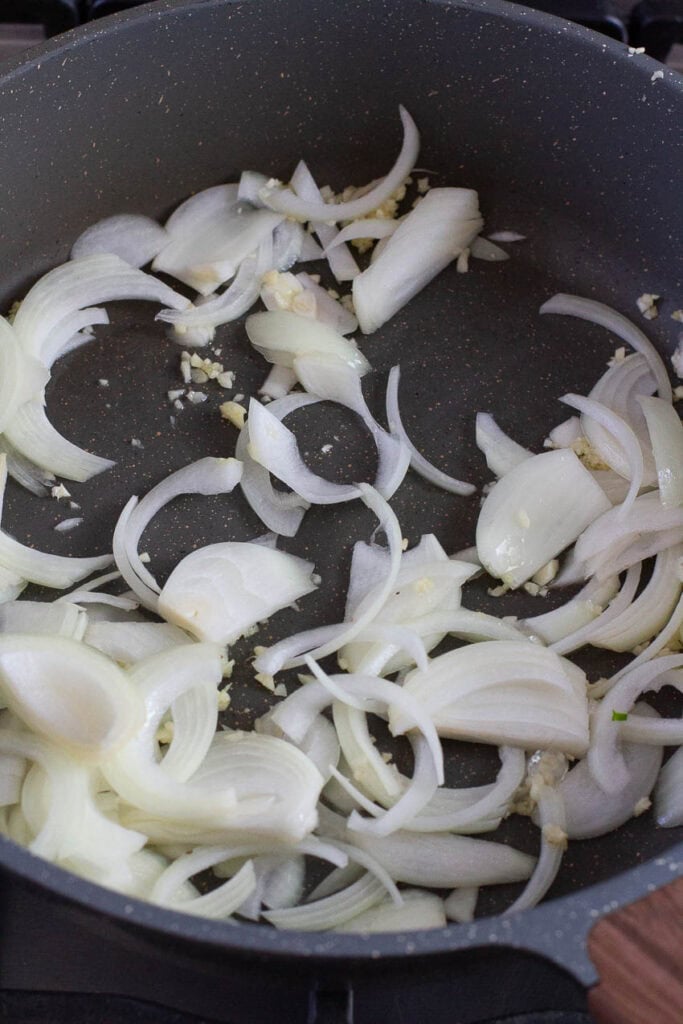 Onion and garlic sautéed in a pan.
