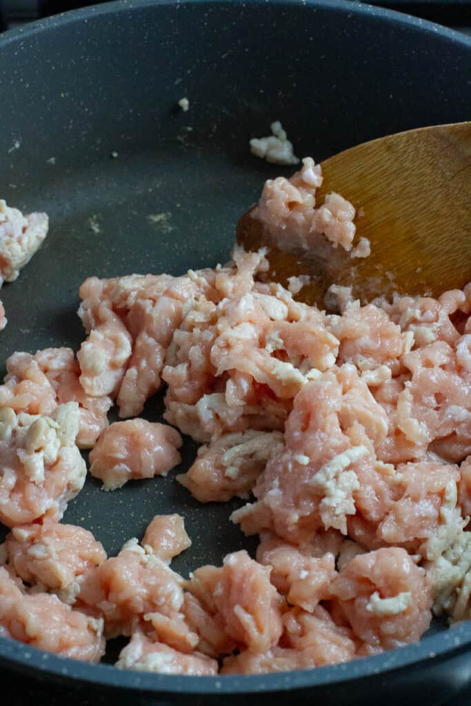 Ground chicken cooked in a pan.