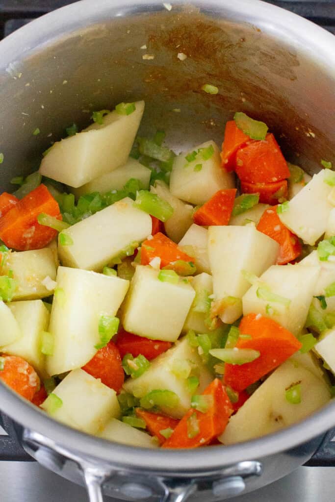 Vegetables sauteéd in a saucepan.