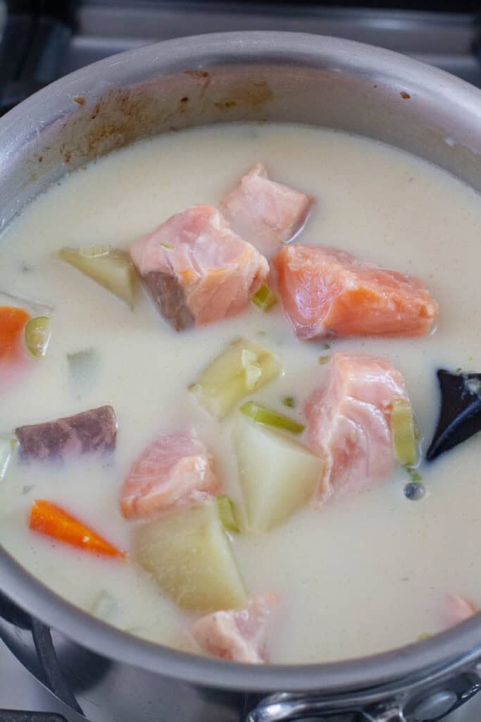 Salmon and vegetables simmered in creamy broth.