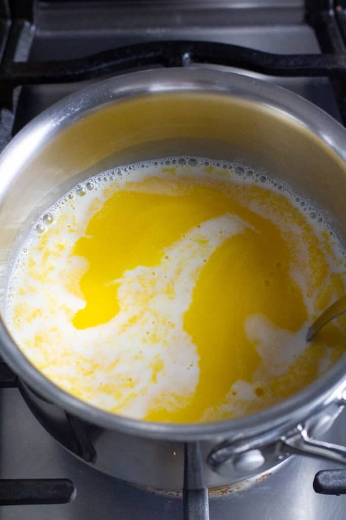 Mango pudding base in a saucepan.