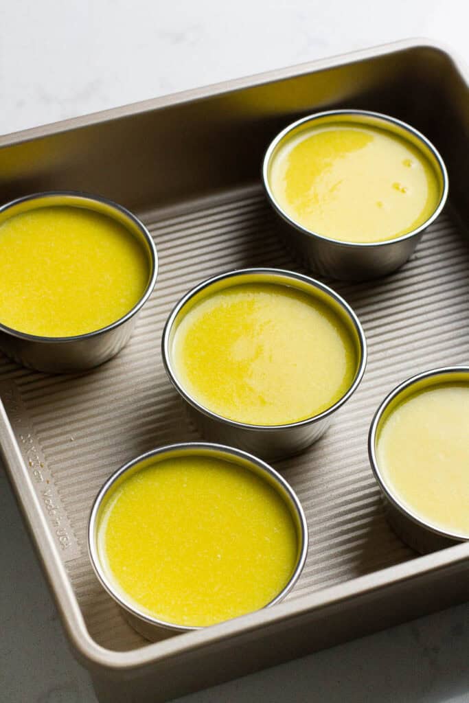 Mango pudding in cup molds.