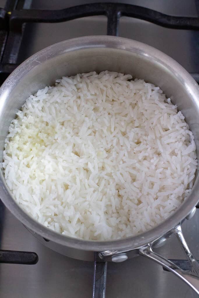 Jasmine rice cooked in a saucepan.
