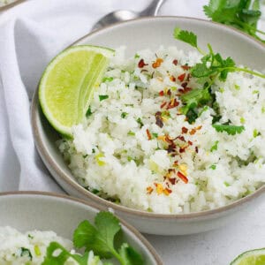 A blow of cilantro lime rice with red pepper flake topping.