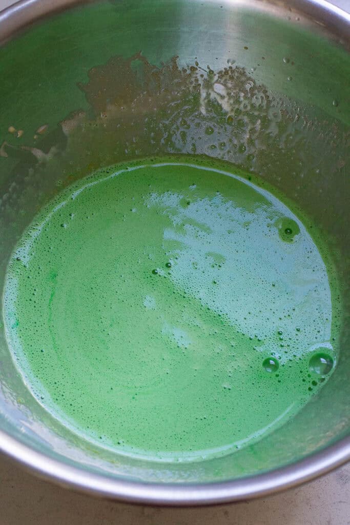 Wet ingredients for pandan chiffon cake mixed in a bowl.