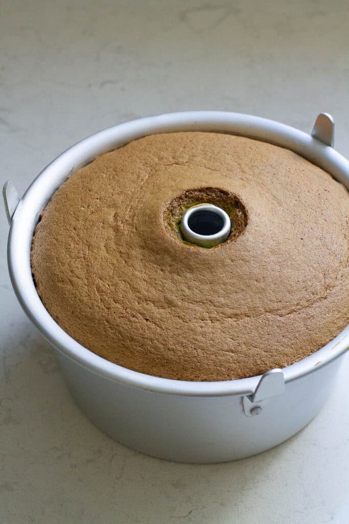 Baked pandan chiffon cake in a tube pan.