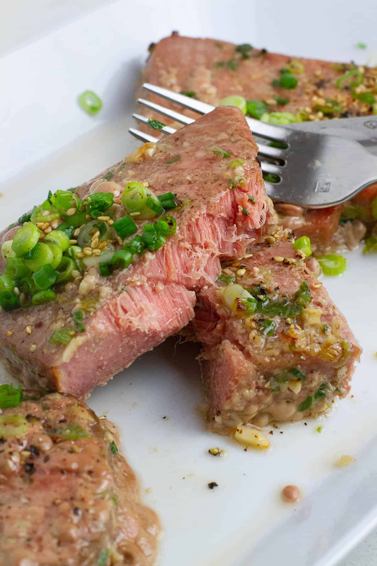 Cut side of a baked tuna steak.