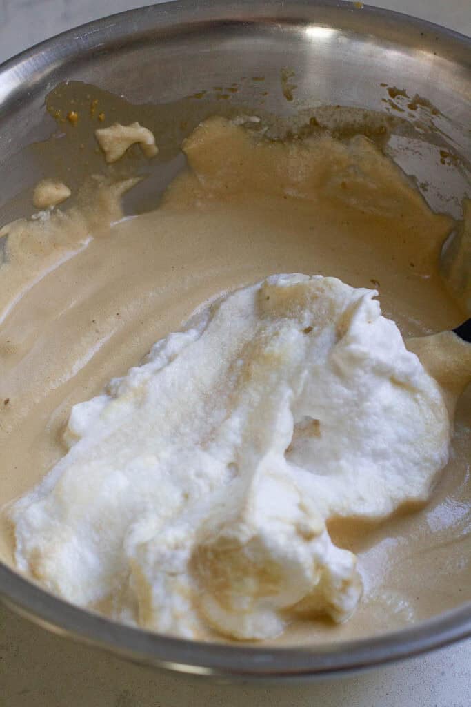 Batter for coffee chiffon cupcakes in a bowl.
