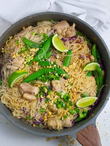 Top view of stay chicken noodles in a pan.