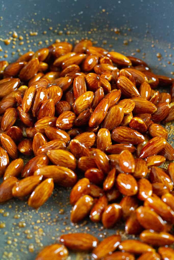 Tamari almonds with tamari maple glaze in a pan.