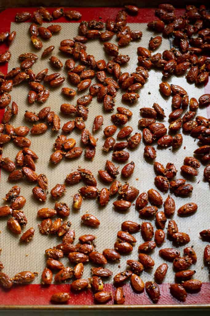 Tamari almonds laid out on a baking sheet.