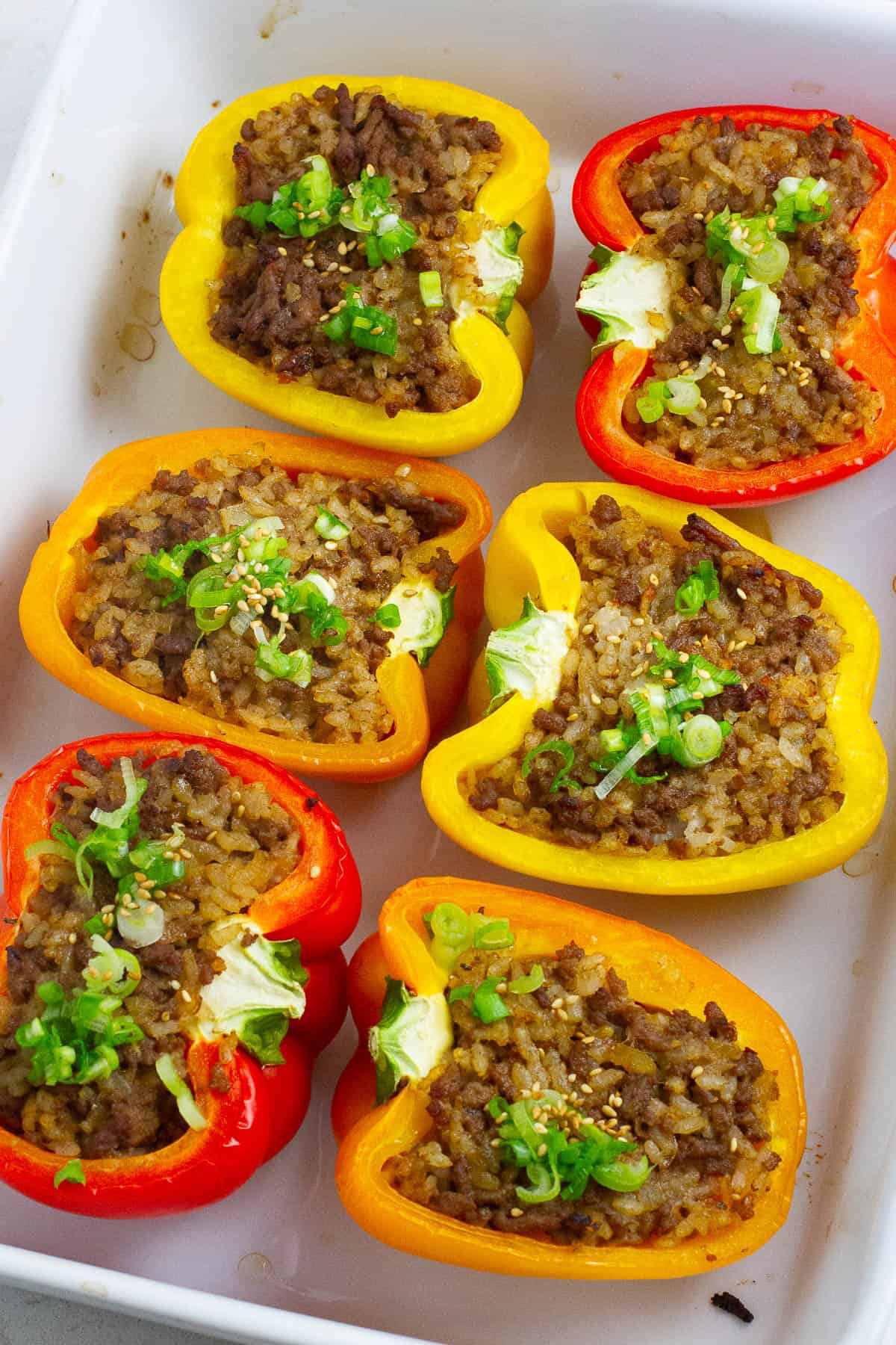 Top view of stuffed peppers with beef and rice.