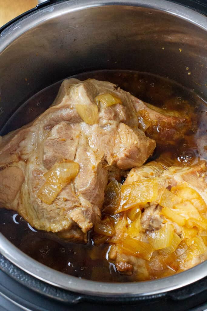 Cooked pork butt meat in an Instant Pot.